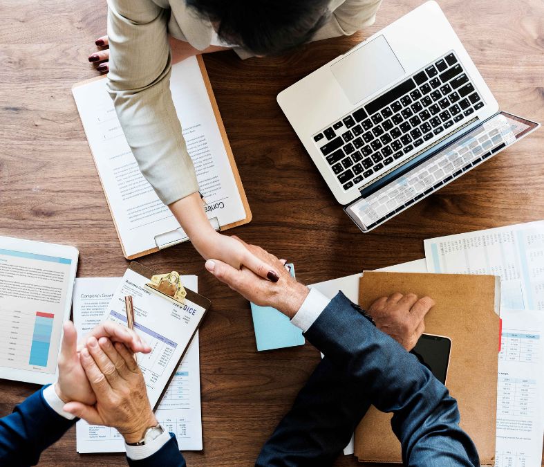 Business meeting with people shaking hands